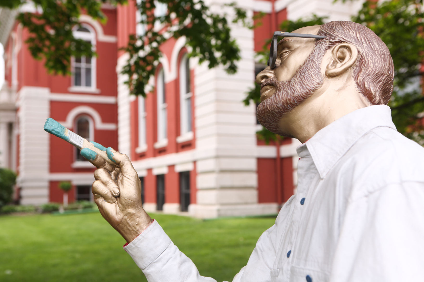 Artist Seward Johnson's "The Tooth" is implanted at the Crown Point Sportsplex